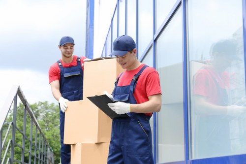 Removal van and movers preparing a local house move in South Hornchurch