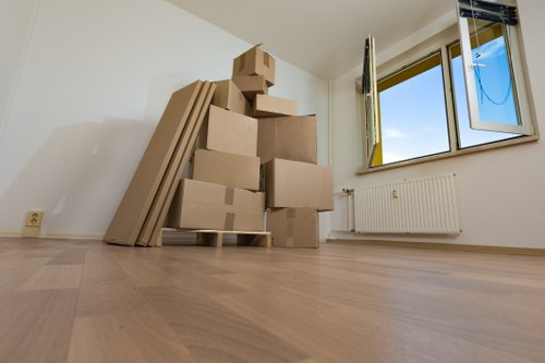 Business premises moving day with labelled boxes and equipment